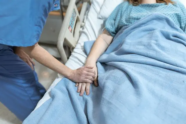 Patient recovering after bone marrow transplant with family support